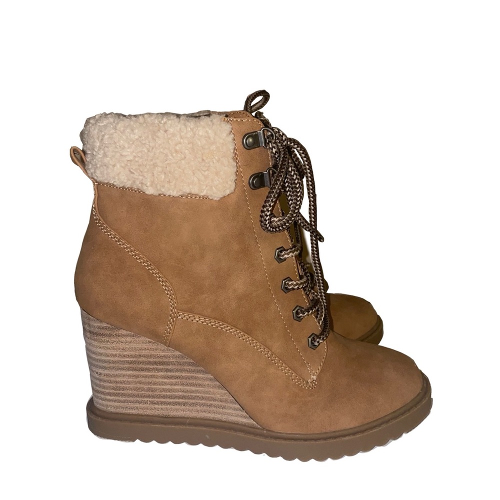 Brand new, never worn heeled boots.